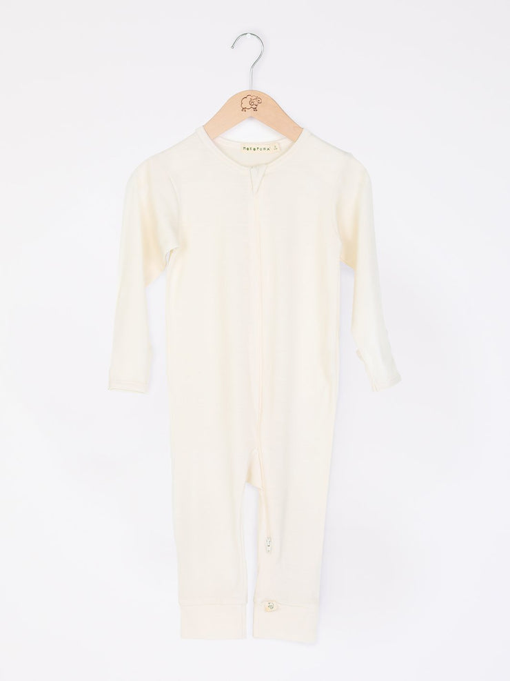 mokopuna all in one romper in merino with long legs, a two-way zip, long sleeves and round neckline in size NB_lily