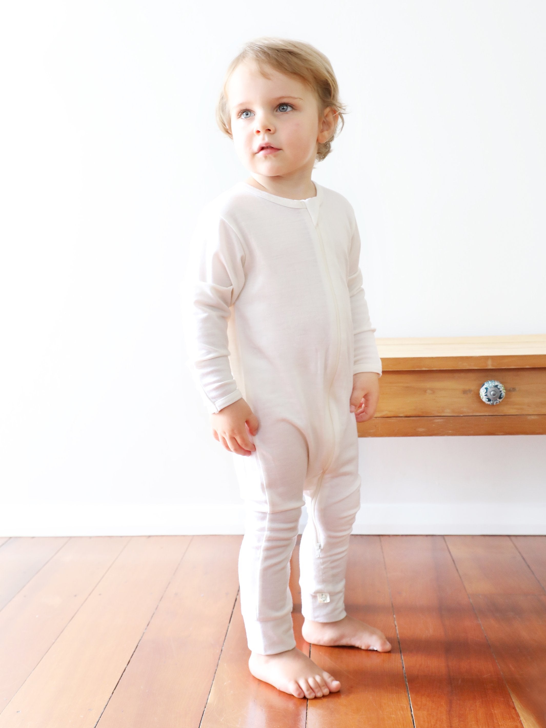 merino zip all in one