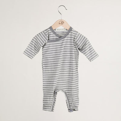 mokopuna all in one romper in merino with long legs with domes, long sleeves and wrap neckline