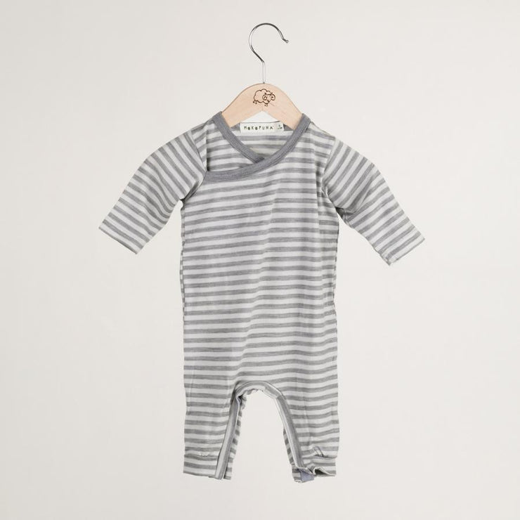mokopuna all in one romper in merino with long legs with domes, long sleeves and wrap neckline