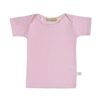 mokopuna baby tee shirt in merino with short sleeves and envelope neckline in size 00_magnolia