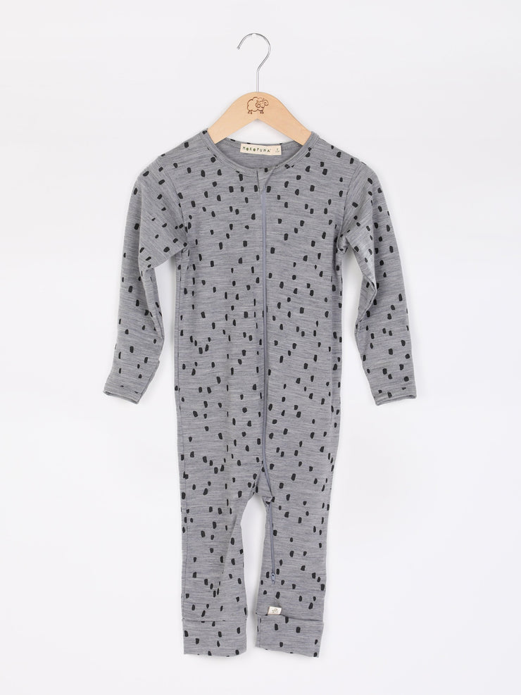 mokopuna all in one romper in merino with long legs, a two-way zip, long sleeves and round neckline in size NB_confetti