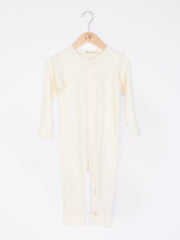 mokopuna all in one romper in merino with long legs, a two-way zip, long sleeves and round neckline in size NB_lily