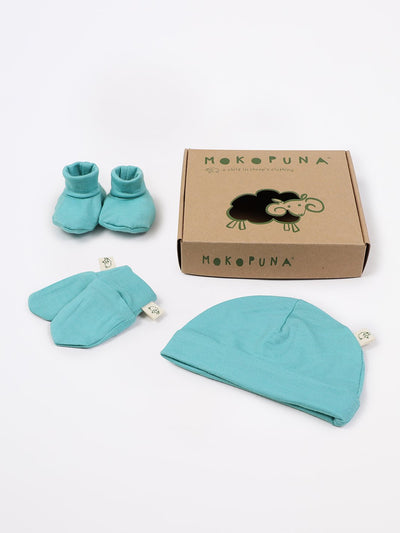 mokopuna set of merino newborn essentials, beanie, booties, scratch mittens, packed in a gift box in size NB_tealeaf